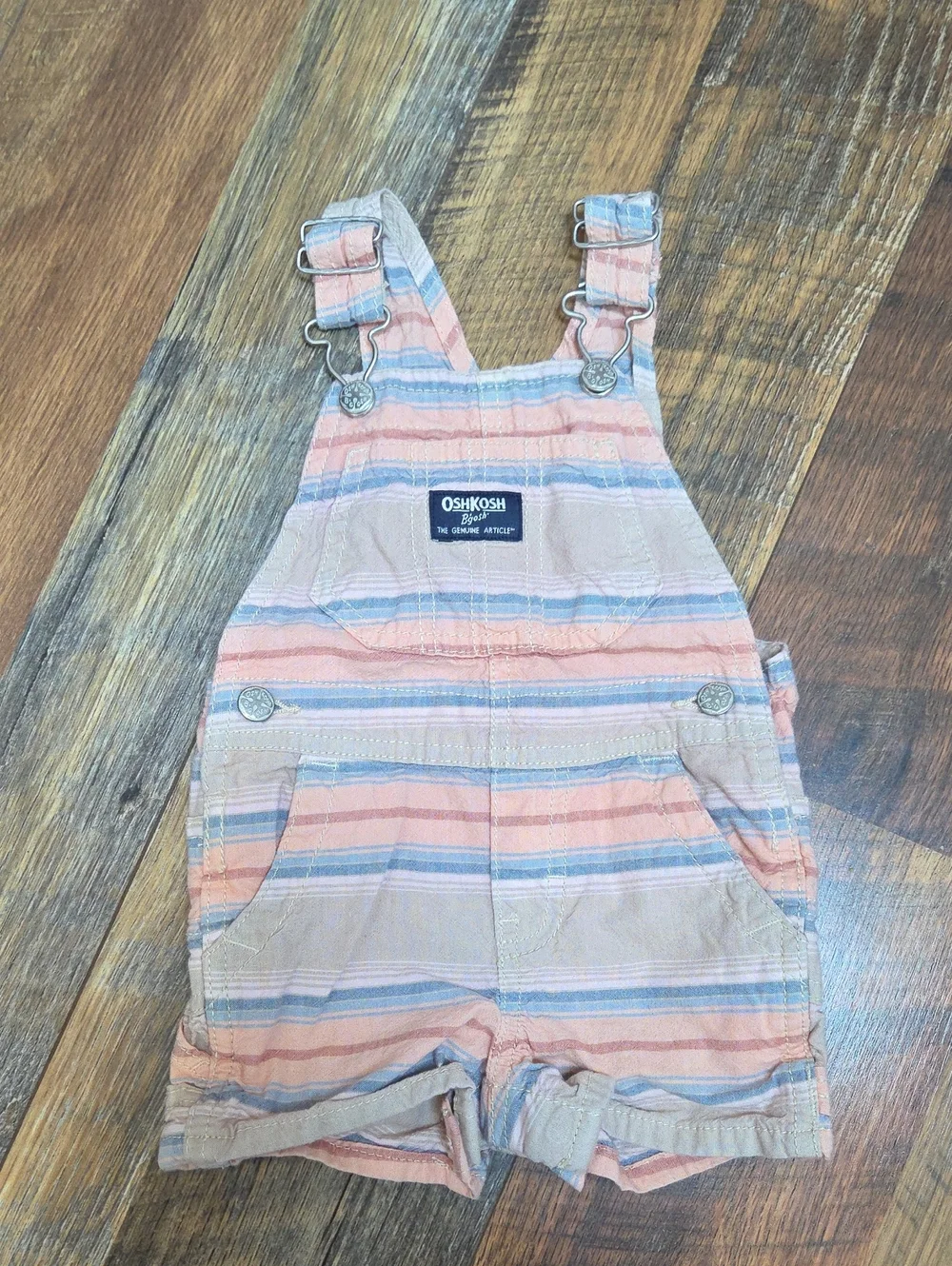 Oshkosh B'gosh Muted Pink, Blue, And Tan Striped Short Overalls, Size 9 Months